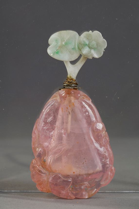 Tourmaline snuff bottle carved in the shape of fruit with foliage and flowers. Jadeite stopper carved in the shape of flowers ... | MasterArt
